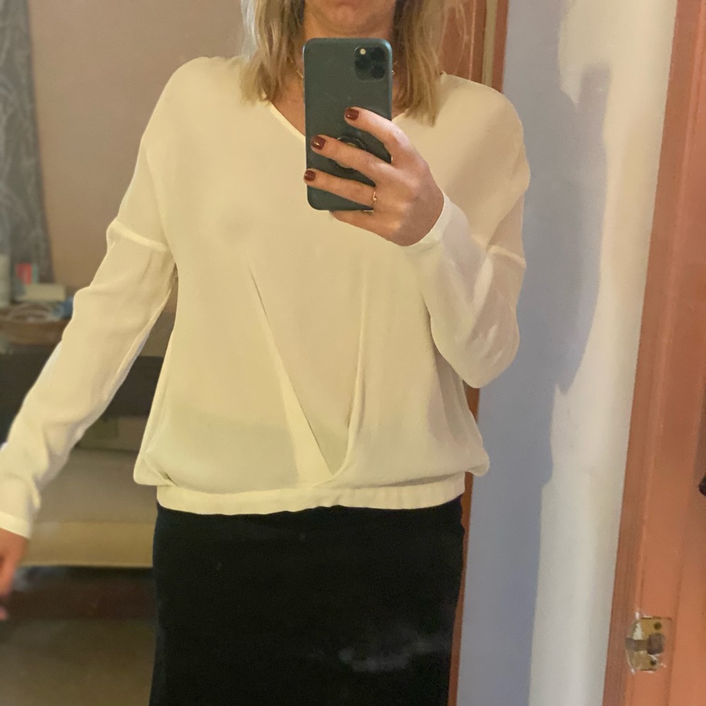Feminine blouse in off white color.